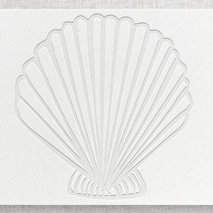 Debossed seashell with no ink. Design is pressed down into the paper bed.