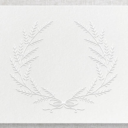 Embossed wreath with no ink color. Design is raised up from the paper bed.