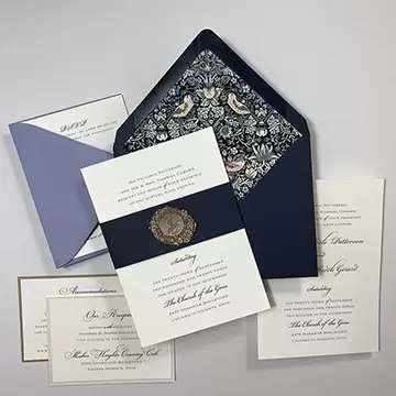 Gold foil names with navy blue band. William Morris Strawberry thief fabric envelope liner.