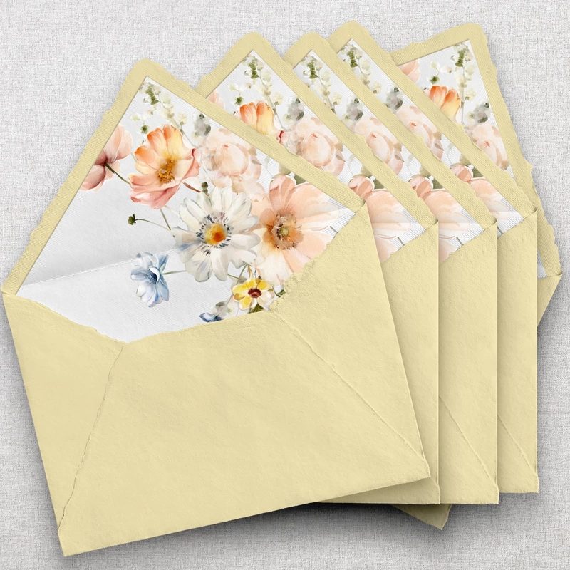 Light yellow handmade envelope with spring wildflower envelope liner.